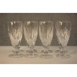 A set of eight 19th century Waterford crystal champagne glasses, with cut bowls and a single knop,