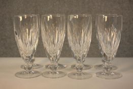 A set of eight 19th century Waterford crystal champagne glasses, with cut bowls and a single knop,