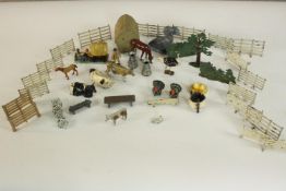 A collection of early 20th century painted lead farmyard toys, fencing, animals and other scenery.