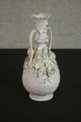 A 19th century Parian ware vase with lilac ground and relief floral decoration and fern motifs (