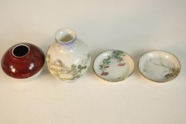 A collection of Asian ceramics and porcelain, including a sang de beuf glaze brush pot, two