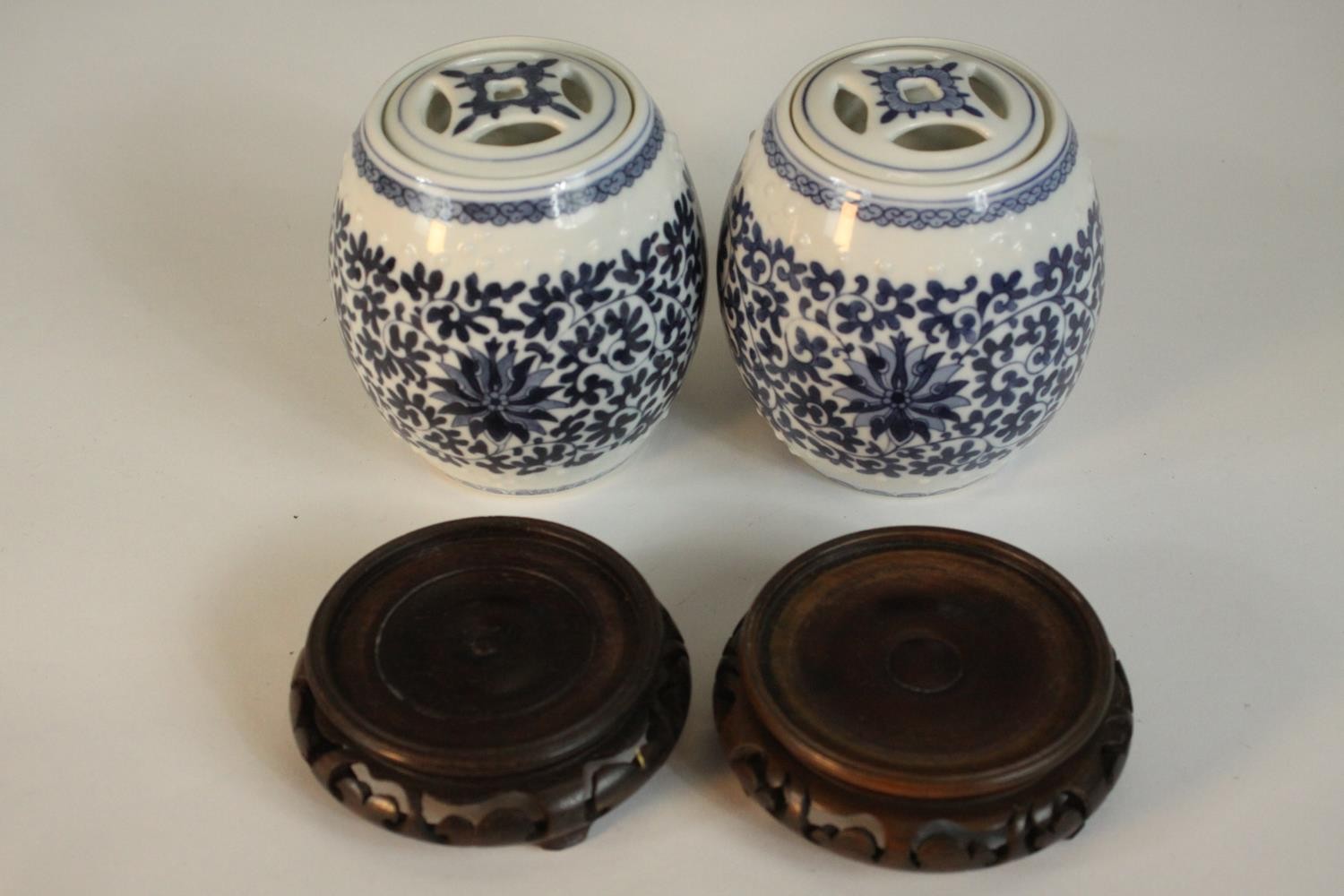 Two blue and white miniature porcelain lidded jars in the form of Chinese stools with stylised - Image 5 of 8