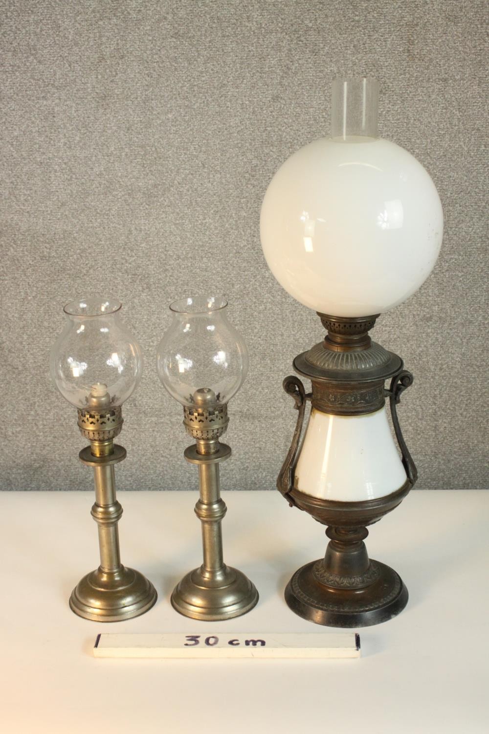 A pair of Victorian silver plated candlesticks, with glass storm shades, together with a converted - Image 2 of 8