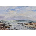 A large framed oil on canvas of a coastal landscape, indistinctly signed along with a watercolour of