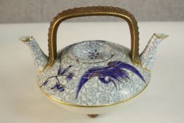 An Aesthetic movement 19th century Royal Worcester twin spout teapot with crane and foliate design