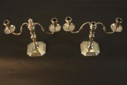 A pair of silver twin branch candelabras by Bryan Savage. H.20 W.23 D.9cm. (each). Weight 1.48kg.