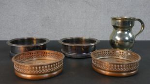 Two pairs of silver plate and oak wine bottle coasters, one with pierced design and a pint measure