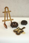 A collection of treen and carved items, including two pierced carved Chinese stands, a handmade