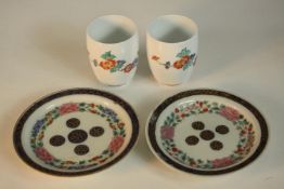A pair of Japanese Kakiemon floral design porcelain cups, signed to base along with a pair of 19th