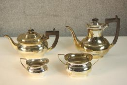 A four piece Edwardian silver tea and coffee set, with ebony handles and finials. Hallmarked: N&W