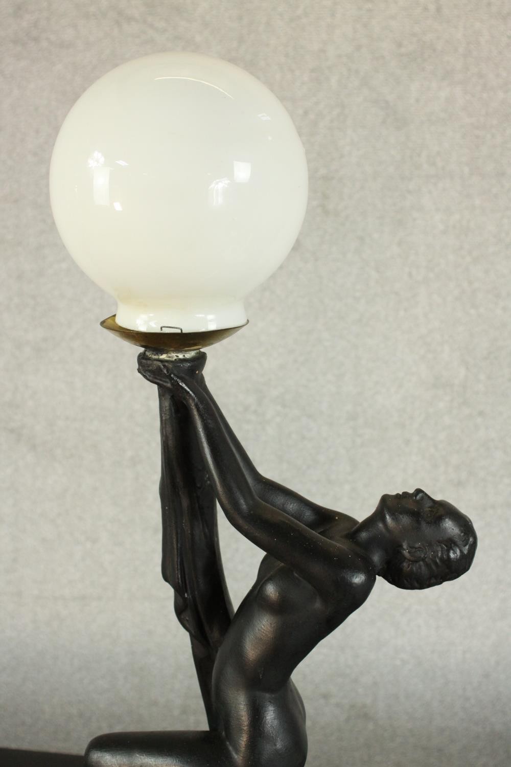 An Art Deco style black resin table lamp in the form of a nude dancer with white glass globe - Image 2 of 6