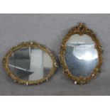 Two oval gilt and moulded plaster mirrors, both frames decorated with acanthus leaves. H.65 W.