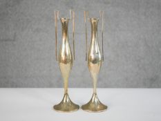 A pair of Art Nouveau design twin handled weighted silver spill vases on flared bases. Hallmarked: