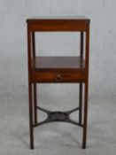 A George III mahogany washstand, with a square top over an undertier with a single drawer, on