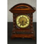 A German H.A.C. walnut mantel clock, made in Wurttemberg, with a fourteen day movement and Roman
