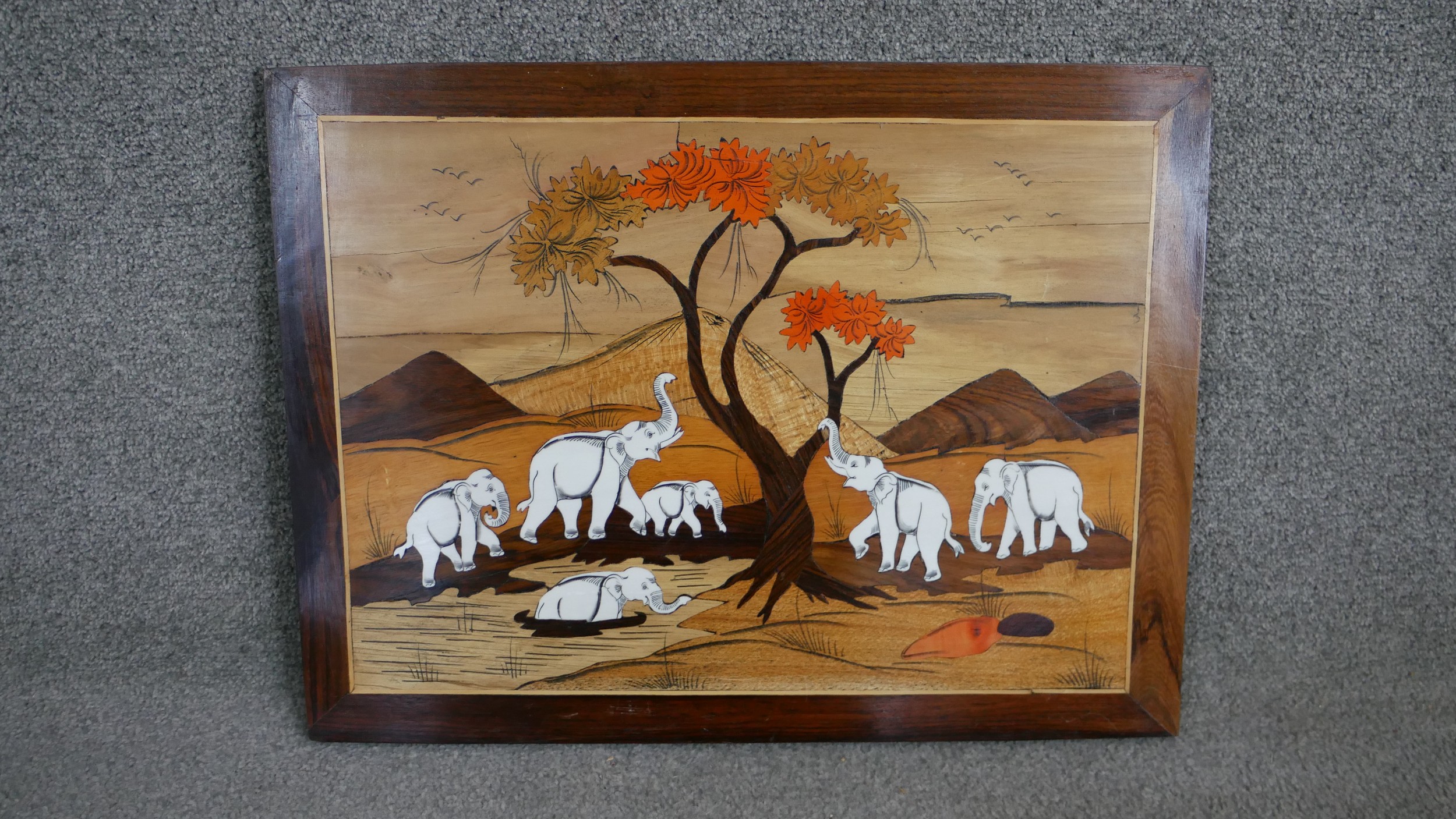 An Indian marquetry panel depicting a herd of elephants at the watering hole under a tree. H.44 W. - Image 2 of 4