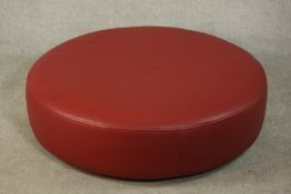 A contemporary Roche Bobois circular red leather stool. H.27 Dia.112cm.