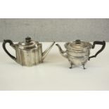 Two sterling silver tea pots with ebony handles. One Edwardian with engraved armorial crest, hall