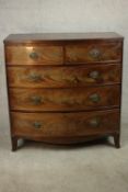 A mid 19th century mahogany bow front chest of two short over three long graduated drawers, over a