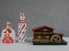 Two 1960's Lomonosov porcelain vodka flasks each with a shot glass along with a carved music box