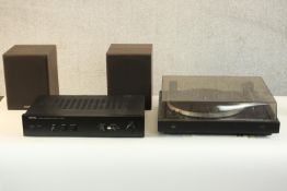 A Rotel stereo integrated amplifier, model RA-810A, together with a Dual CS 505-3 Audiophile Concept