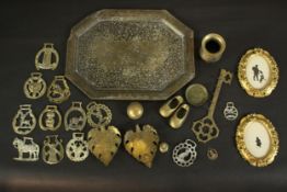 A collection of horse brasses, an Islamic design tray and other items along with a pair of gilded