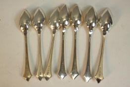 A collection of silver spoons and four silver engraved drinks labels. A set of six Art Nouveau