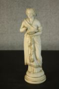 A bisque porcelain Classical figure, female god on a plinth, with gilded details. (hand missing) H.