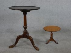 A 20th century George III style mahogany tripod table, with a circular top on a turned stem and