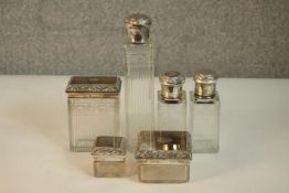 A collection of six Austrian silver and engraved glass dressing table bottles and lidded boxes,