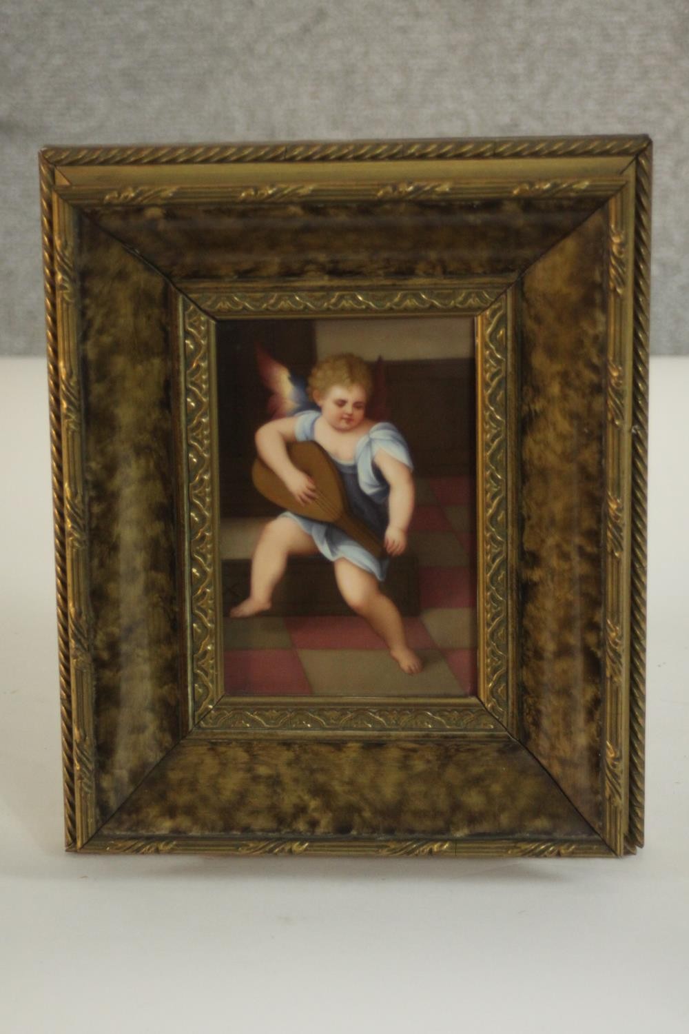 A framed painting on porcelain of an angel playing a lute, inscribed in pencil and stamped - Image 2 of 8
