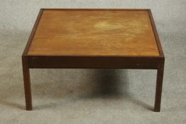 A circa 1960s teak and mahogany coffee table of square form. H.38 W.82cm.
