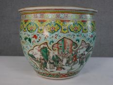 A large Chinese early 20th century porcelain gold fish bowl, the outside hand painted with a