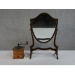 An Edwardian shield shape mahogany framed dressing mirror along a French Japy Freres and Co coffee