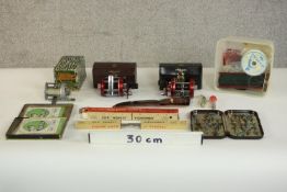 A collection of vintage fishing equipment, including two leather cased Ambassadeur fishing reels,