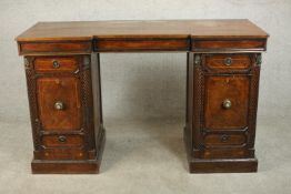 A Regency mahogany and line inlaid inverted breakfront pedestal sideboard, each pedestal with a