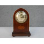 An early 20th century Smith Electric mahogany lancet form mantel clock, the case with marquetry