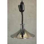 A polished chrome conical ceiling lamp with extendable coiled cable. H.90 Dia.37cm.