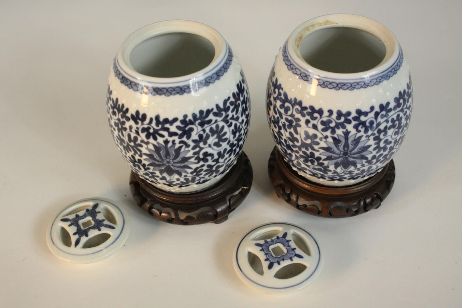 Two blue and white miniature porcelain lidded jars in the form of Chinese stools with stylised - Image 4 of 8