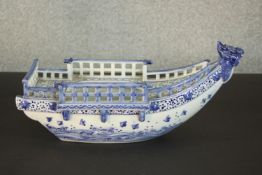 A Chinese blue and white porcelain model of a boat, 20th century, the interior of bowl form