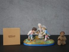 A 19th century Meissen hand painted porcelain figure group of three children playing (crossed