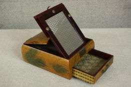 A 20th century Japanese travelling lacquer vanity box with lift-up mirror, decorated with mandarin