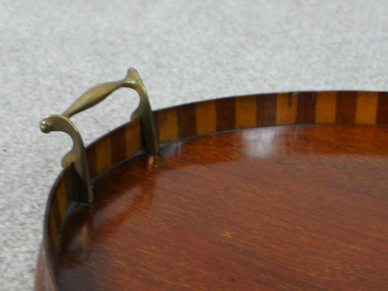 An Edwardian walnut and marquetry inlaid oval tray, with two brass handles, the centre inlaid with a - Image 3 of 4