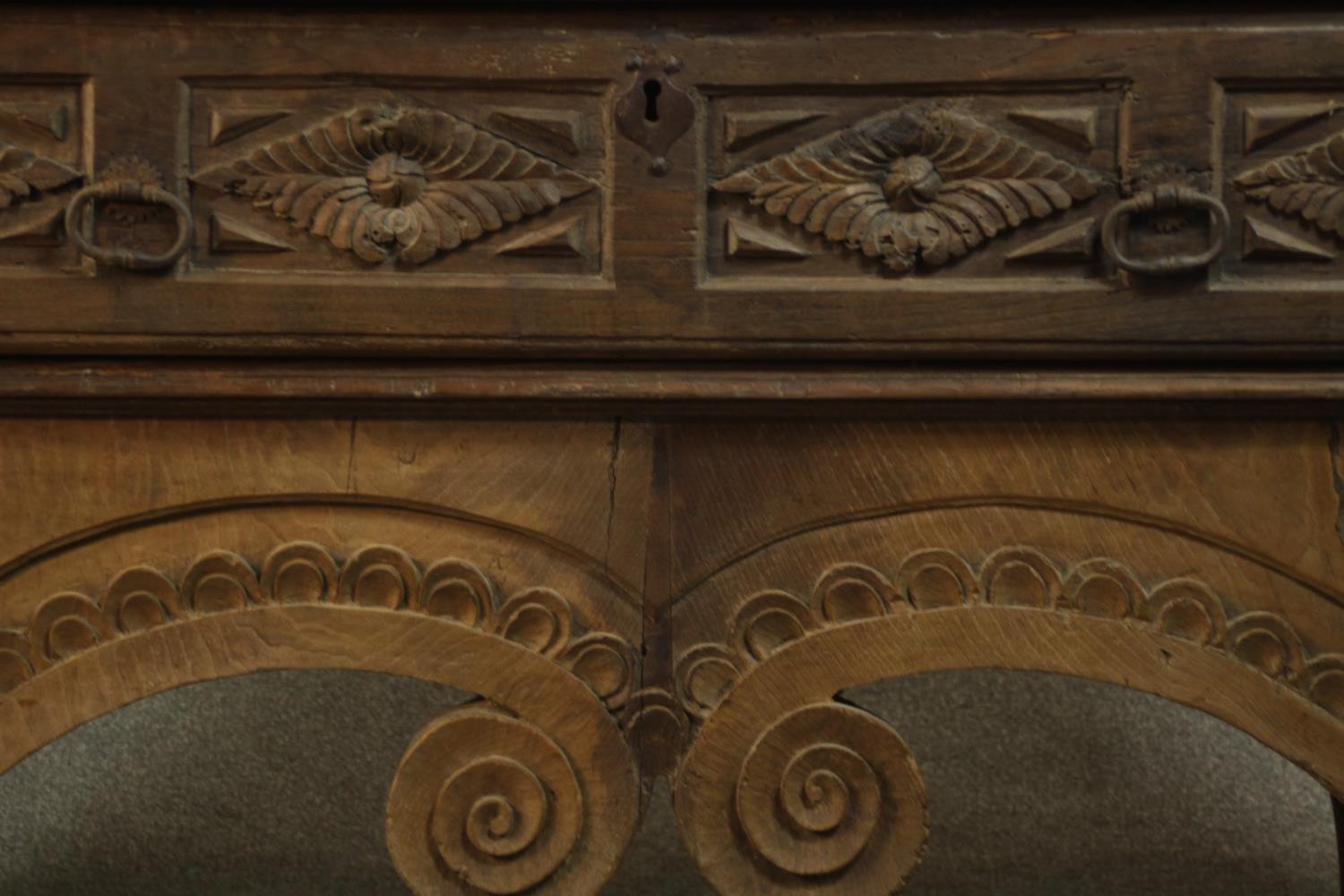 An Eastern carved hardwood side cabinet on scrolling shaped supports. H.82 W.175 D.82cm. - Image 4 of 16