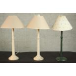 A pair of cream painted turned table lamps along with a dark green painted lamp. H.56 Dia.15cm. (