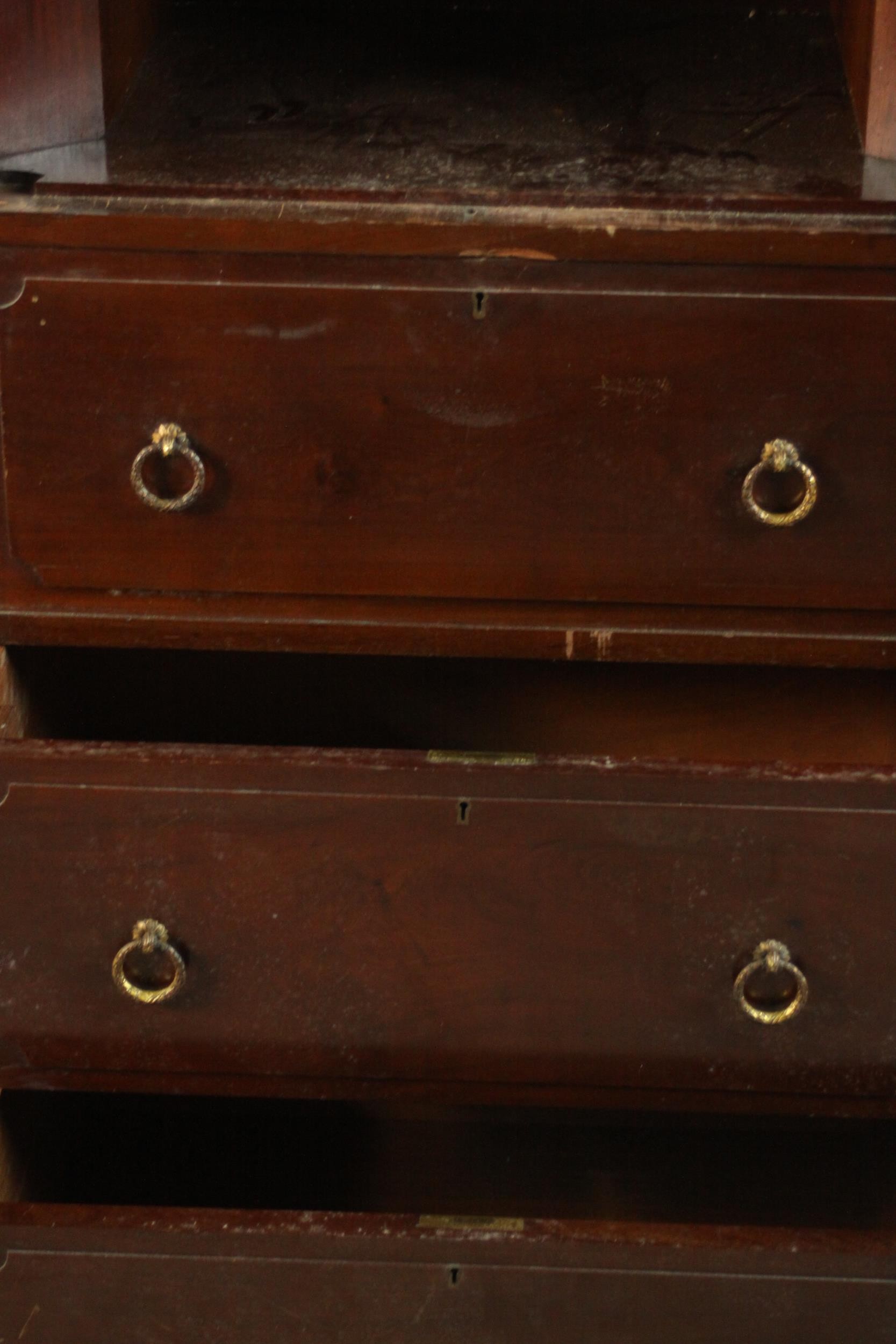 A Continental walnut bookcase with open shelves above drawers on tapering reeded supports. (back - Image 6 of 9