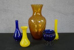 A collection of vintage and antique glass vases. Including two vintage opaque yellow glass vases and