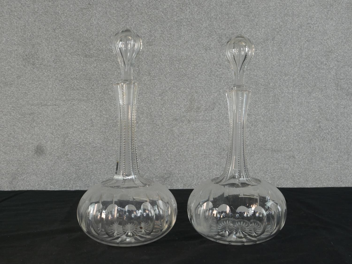 Three clear glass pharmaceutical demijohns along with a pair of cut glass decanters and three - Image 3 of 5