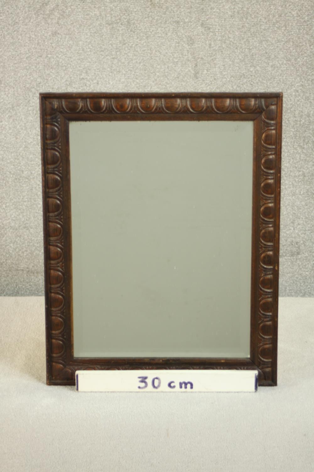 An early 20th century rectangular oak wall mirror, the frame carved with an egg and dart type - Image 2 of 5