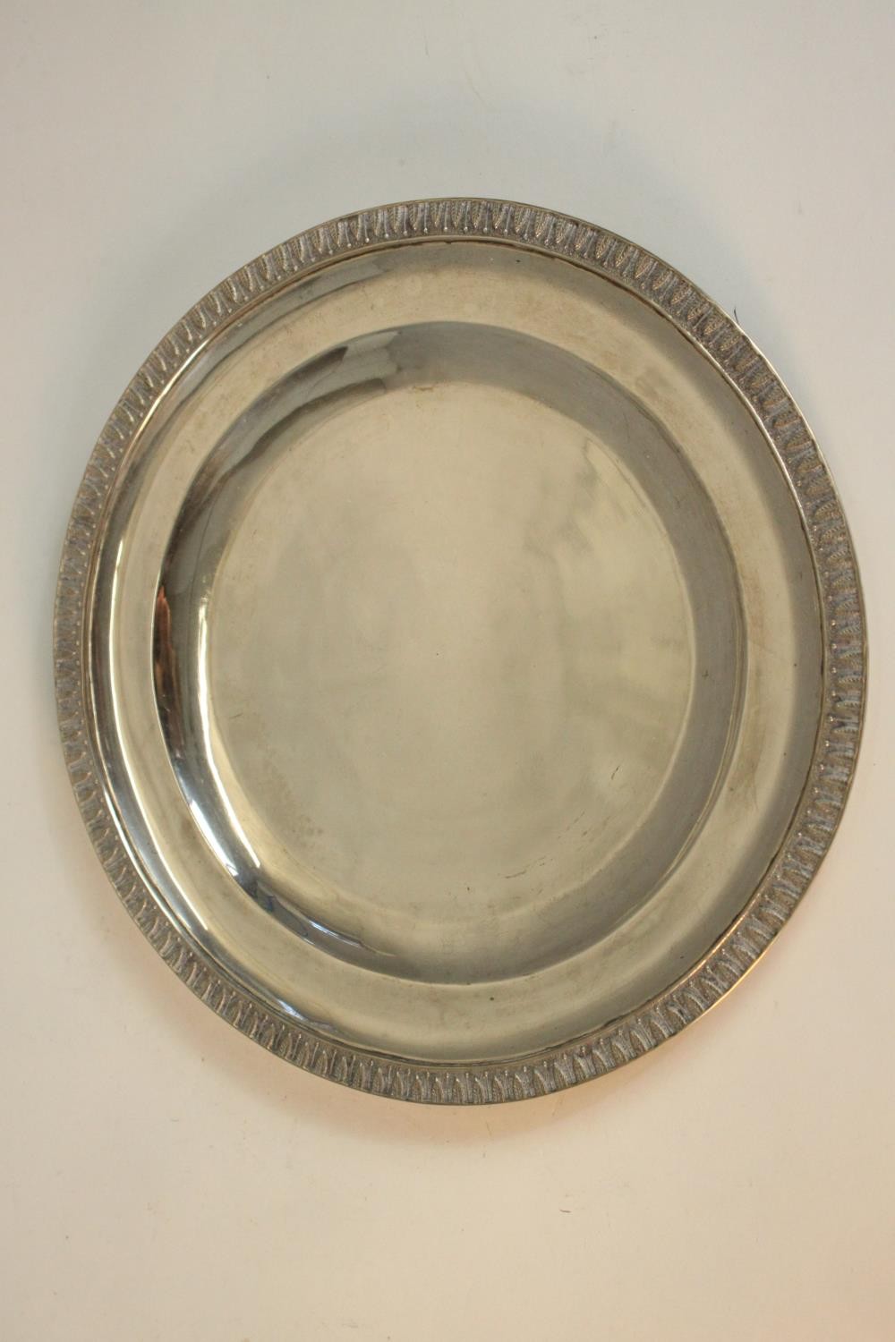 A Polish silver circular tray with stylised leaf design around the rim. Polish assay marks, makers